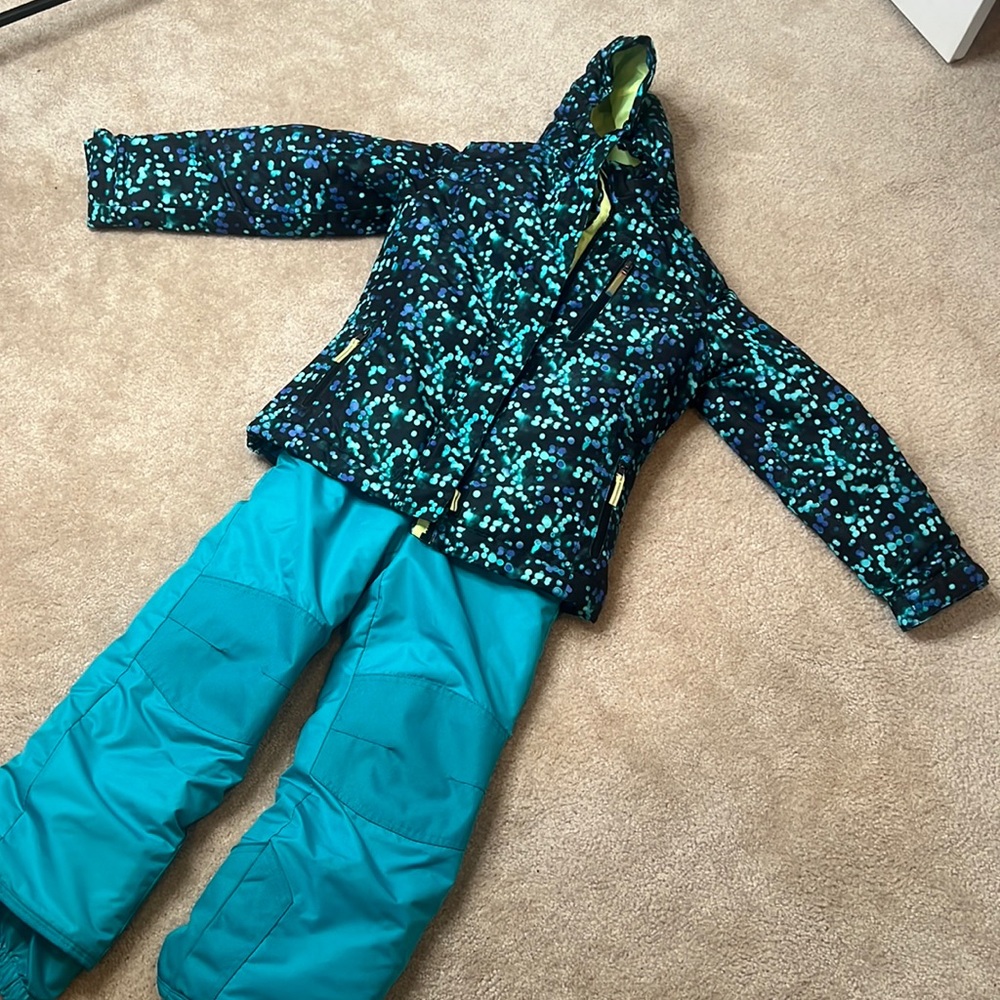 Girls champion puffer jacket with fleece liner and matching snow bibs.